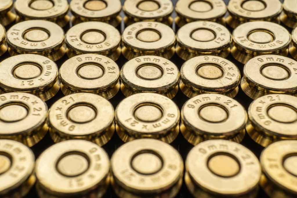 Close-up of a group of 9mm rounds. Cartridge background. New cartridges stacked neatly near each other.