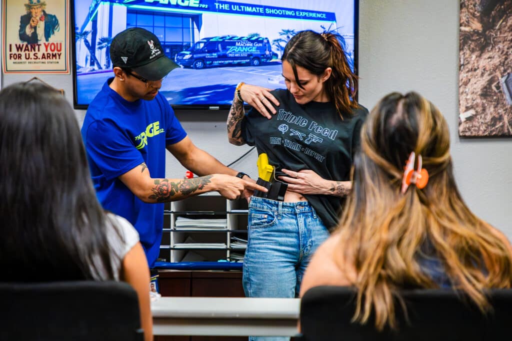 Instructor Showing Women The Fundamentals Of Markesmanship