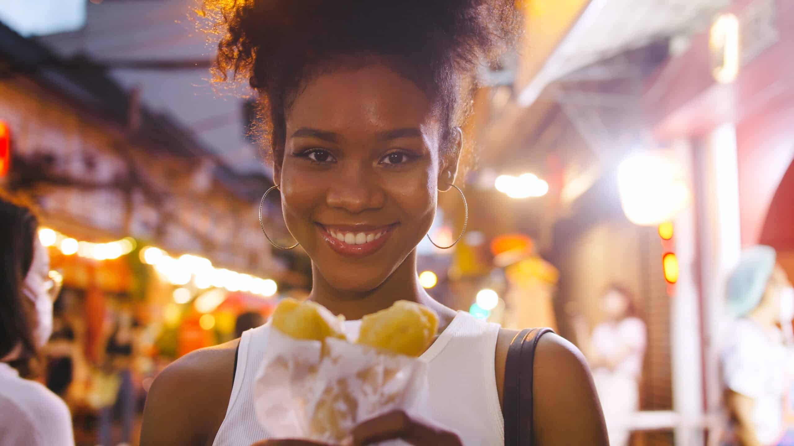 lady about to eat at a foodie walking tour