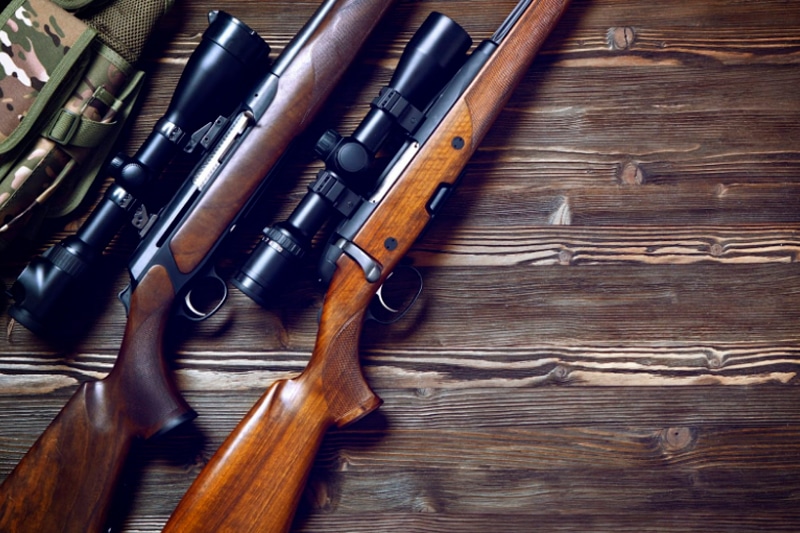 Two Rifles And Hunting Equipment