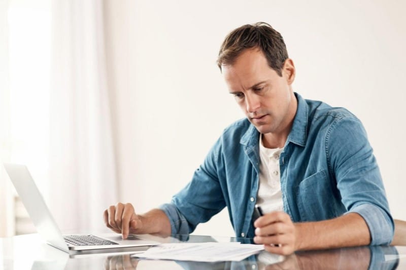 Man looking through Paperwork