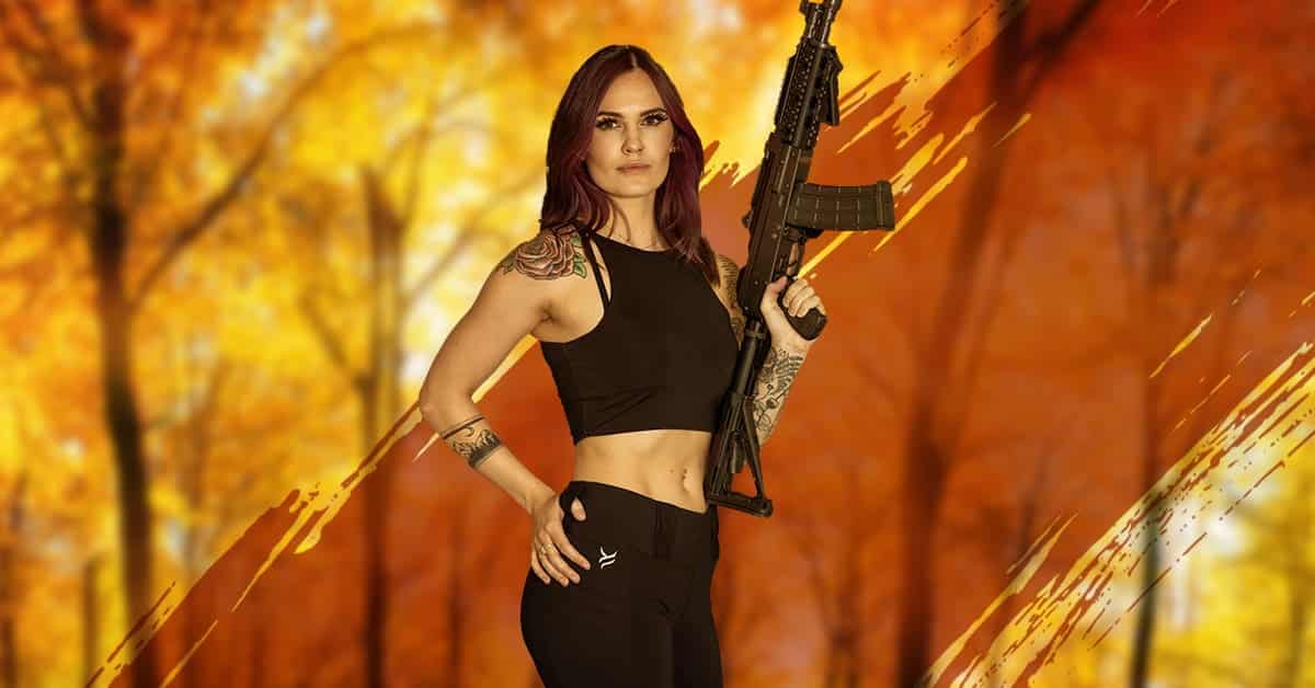 A woman with a gun.