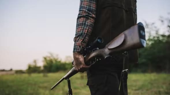 Hunter holding a rifle