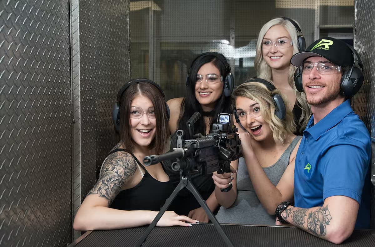 group of people around a machine gun