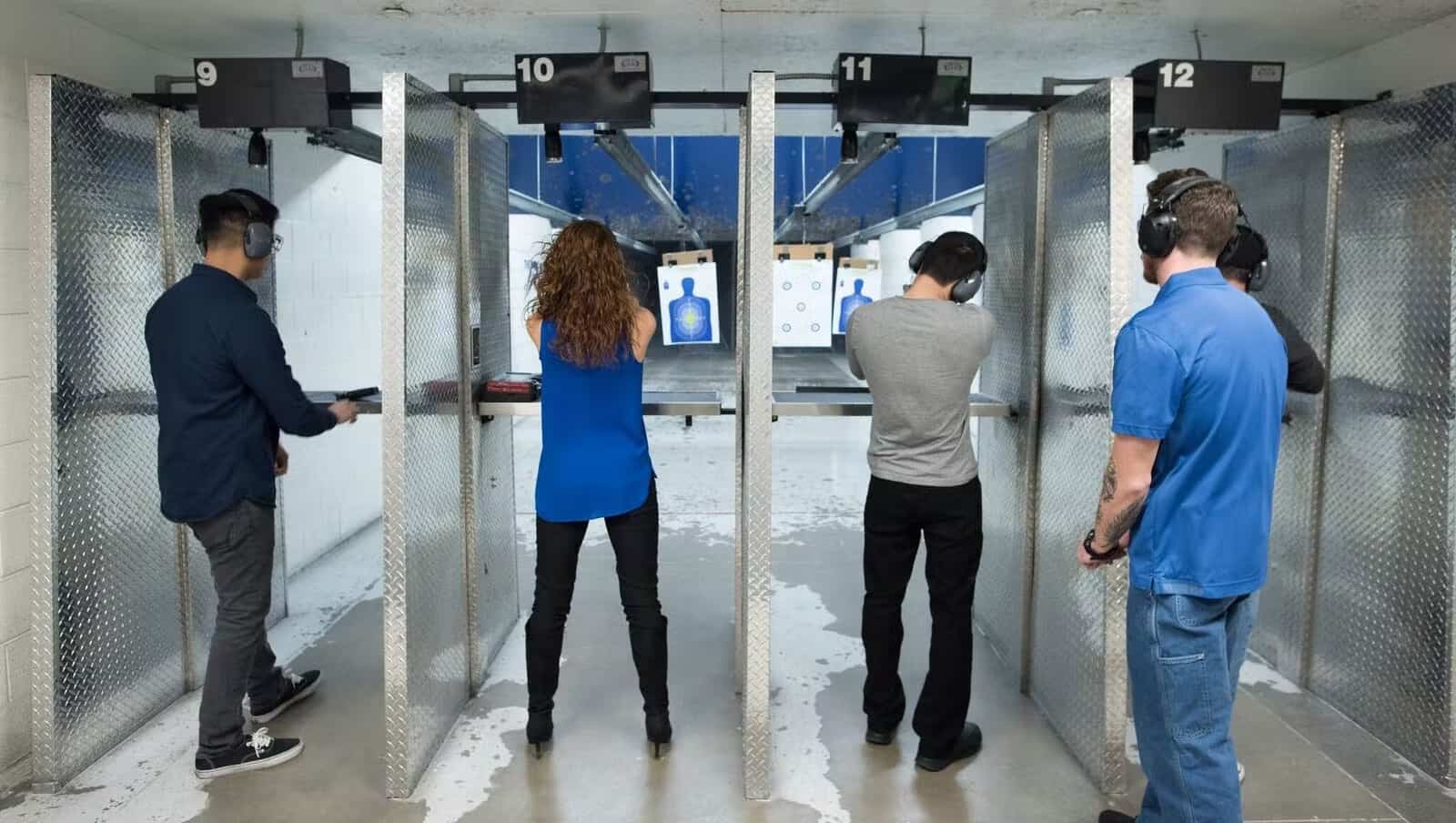 two people shooting guns at the range 702 in Las Vegas