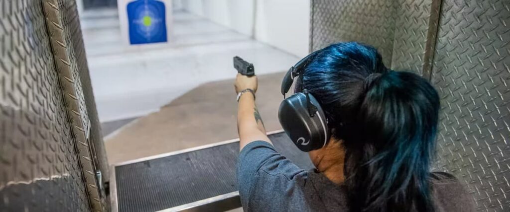 A woman shooting a target at The Range 702.