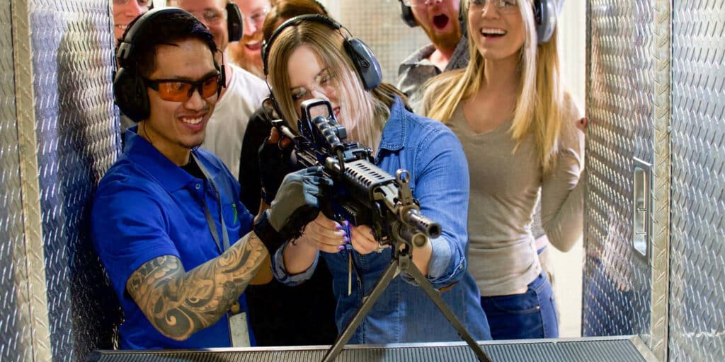 lady shooting machine gun at shooting range in las vegas