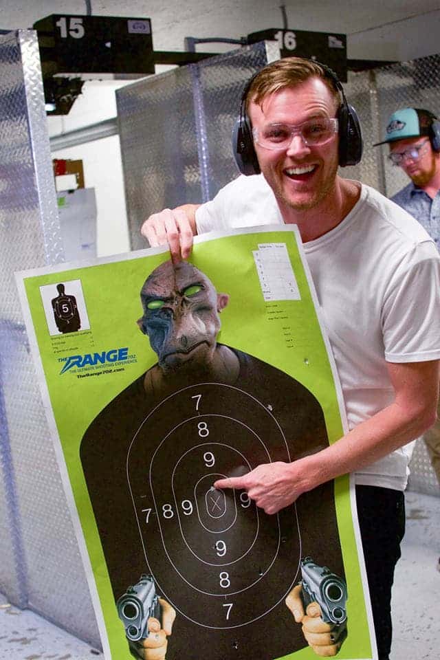 man holding shooting target