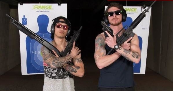 Two People Holding Guns Crisscrossed Across Their Chest At The Range 702.