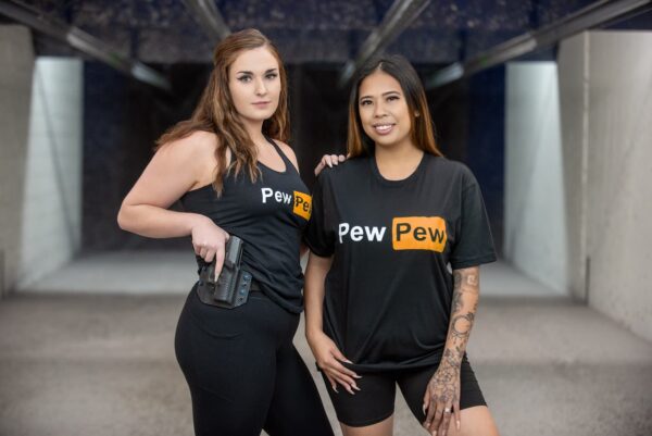 Two women with "Pew Pew" shirts.