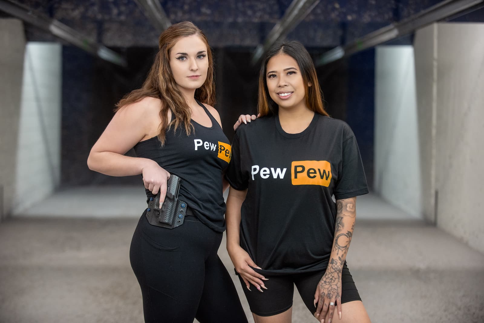 Two Women With &Quot;Pew Pew&Quot; Shirts.