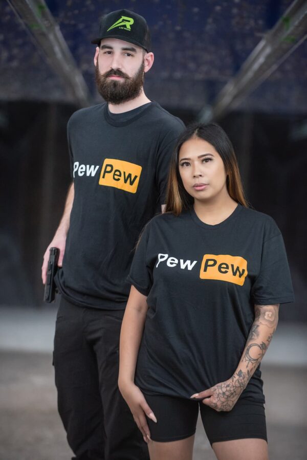 A man and a woman with "Pew Pew" shirts.