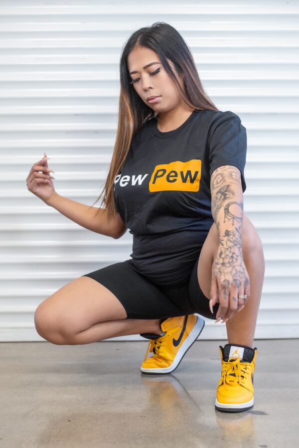 A woman with a "Pew Pew" shirt.