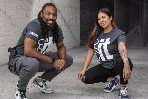 Two people posing at The Range 702.