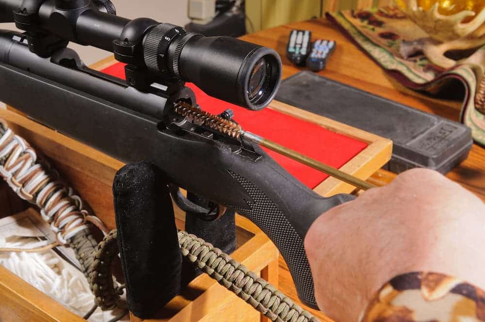 person cleaning rifle at a shooting range in las vegas