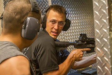 man shooting machine gun at a shooting range in las vegas