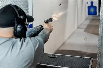 man shooting handgun at a gun range in las vegas