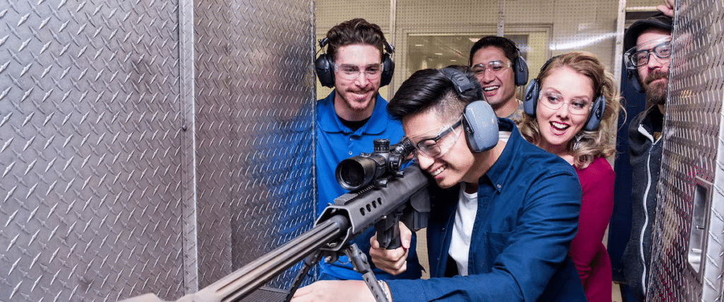 A group watches a man shooot at The Range 702.