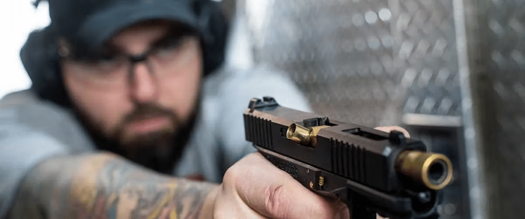 A close-up view of a man shooting at The Range 702.