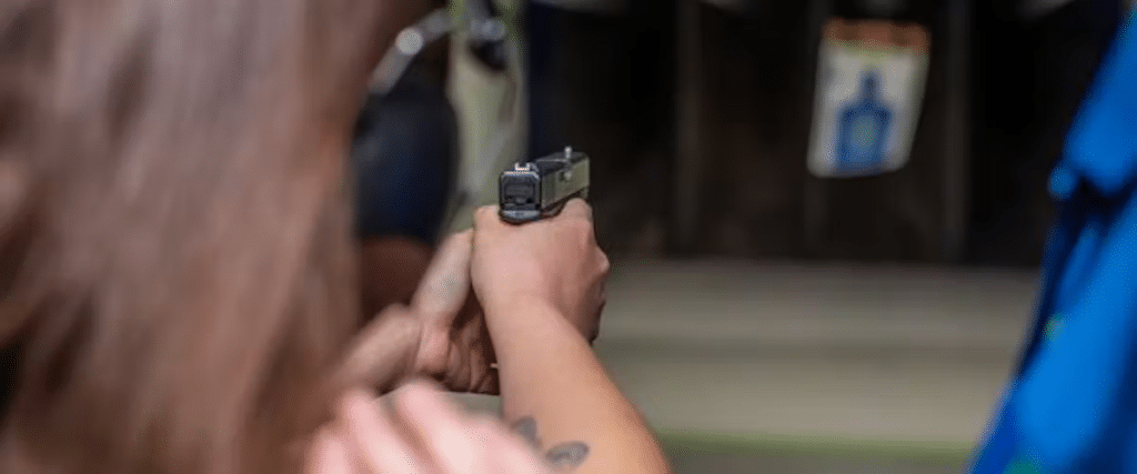 An up-close view of a woman shooting a target at The Range 702.