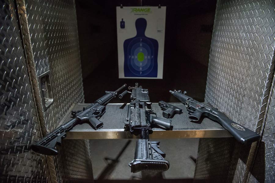 Three guns in front of a shooting target at The Range 702.