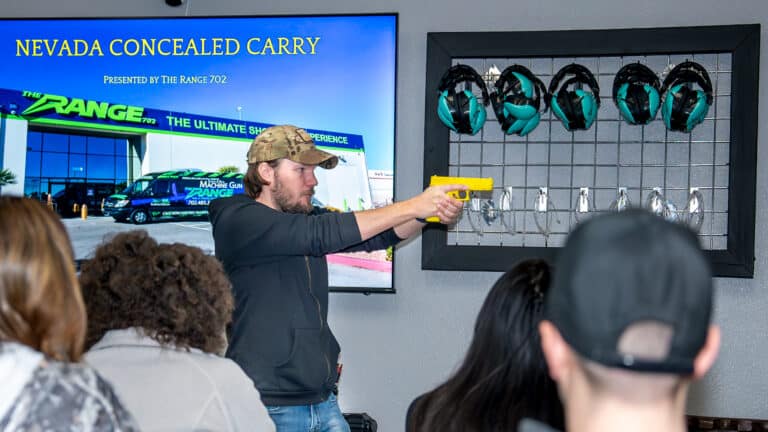 The Lead Ccw Instructor At The Range 702 In Las Vegas Demonstrates Grip And Sight Alignment To A Ccw Class