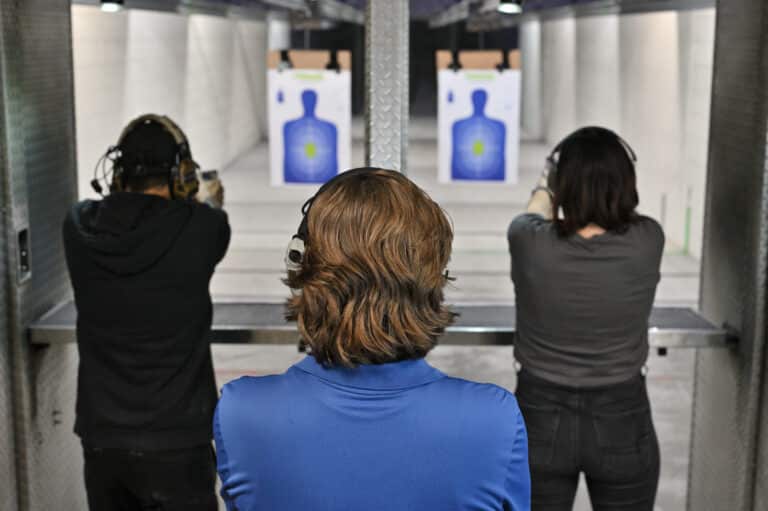 A CCW instructor at The Range 702 in Las Vegas observes students on the shooting range